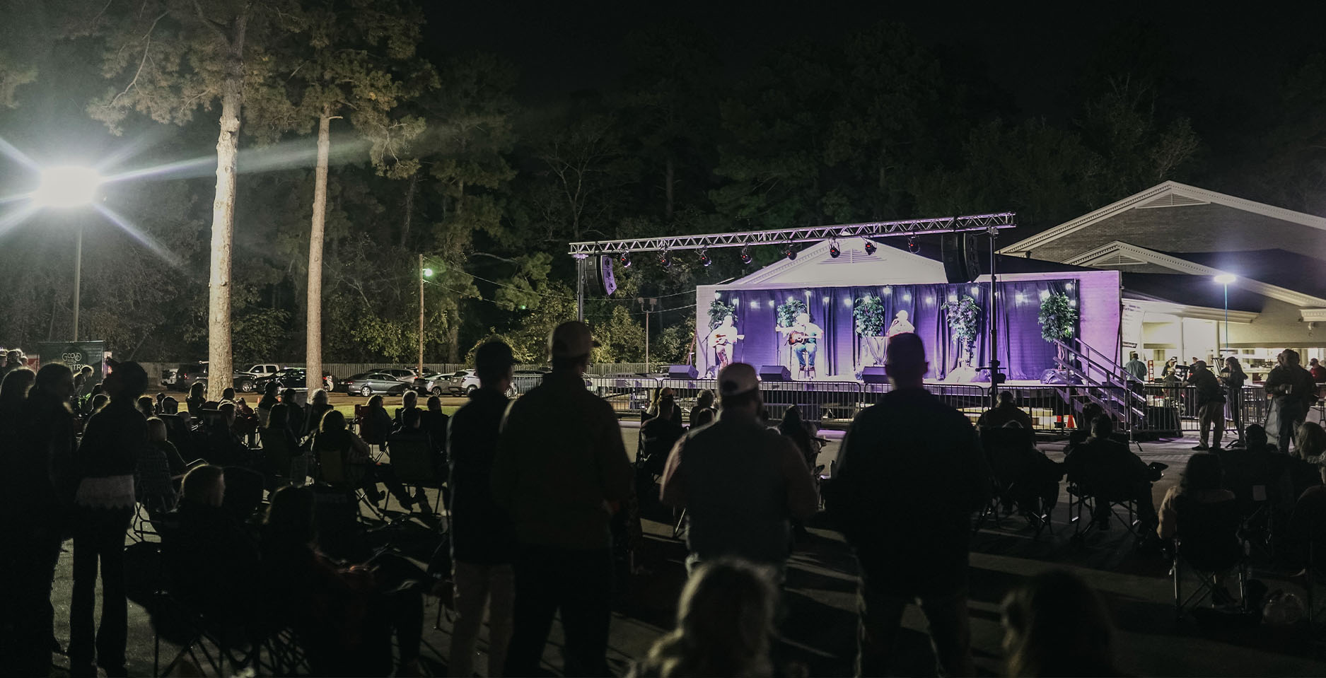 crowd watching concert at night